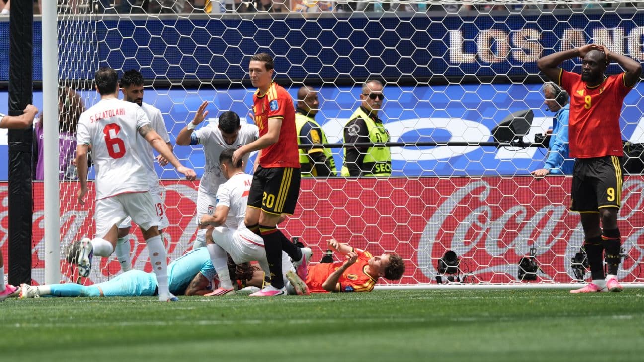 Iran goalkeeper Alireza Beiranvand makes a save during his team's World Cup match against Belgium.