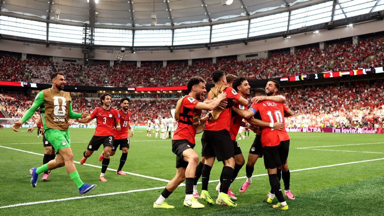 Egypt players celebrate after scoring a goal against New Zealand in the World Cup.