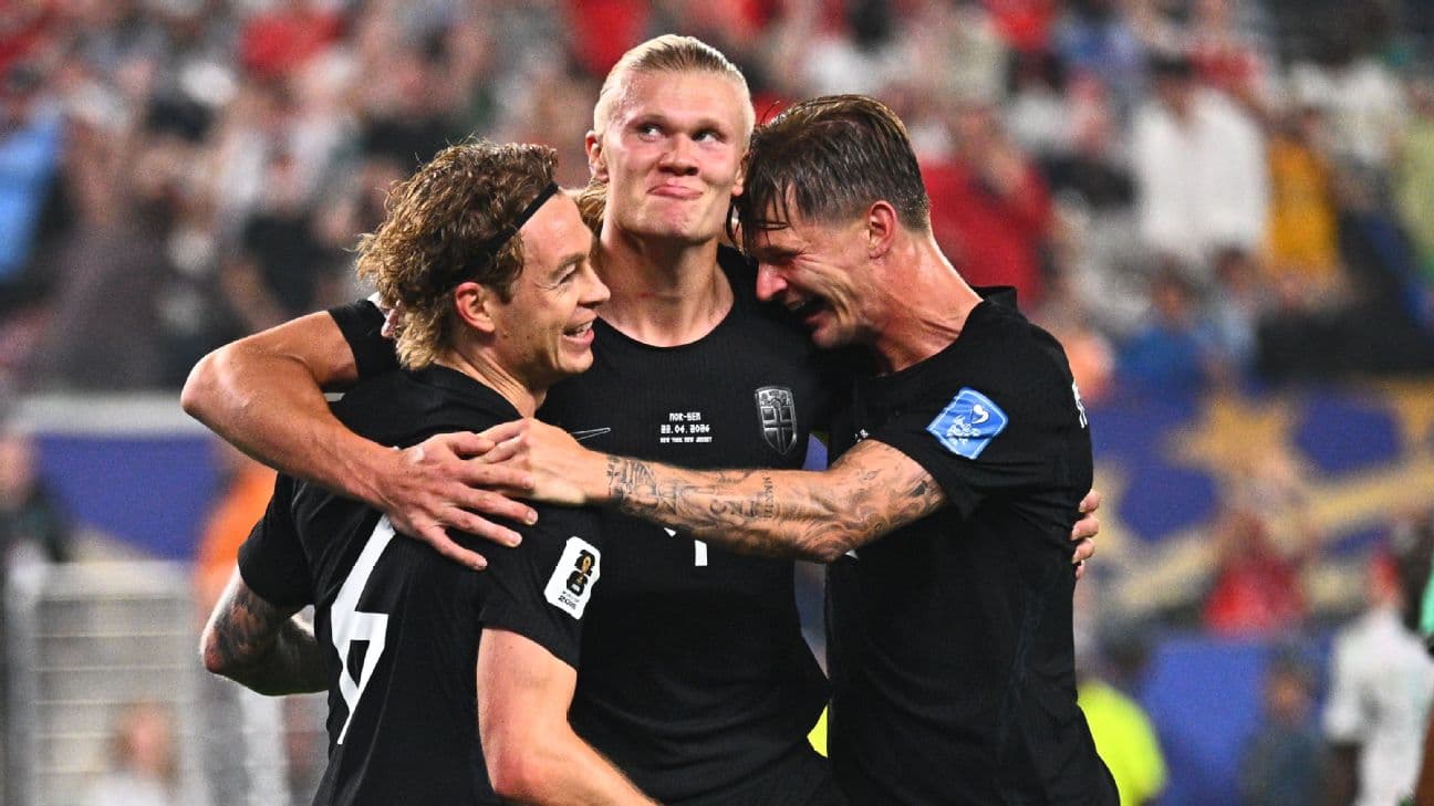 Erling Haaland celebrates with his Norway teammates after scoring a goal against Senegal at the World Cup.