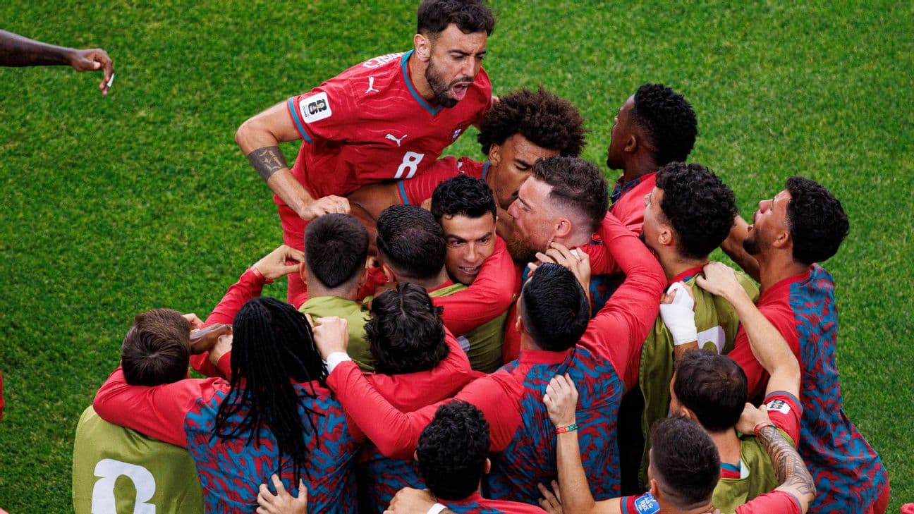 Ronaldo celebrates with teammates after scoring his second goal.