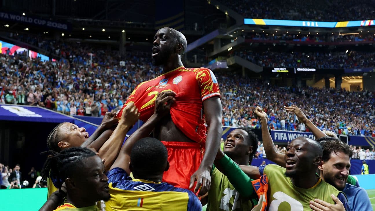 Yoane Wissa celebrates with teammates after scoring Congo DR's third goal against Uzbekistan.
