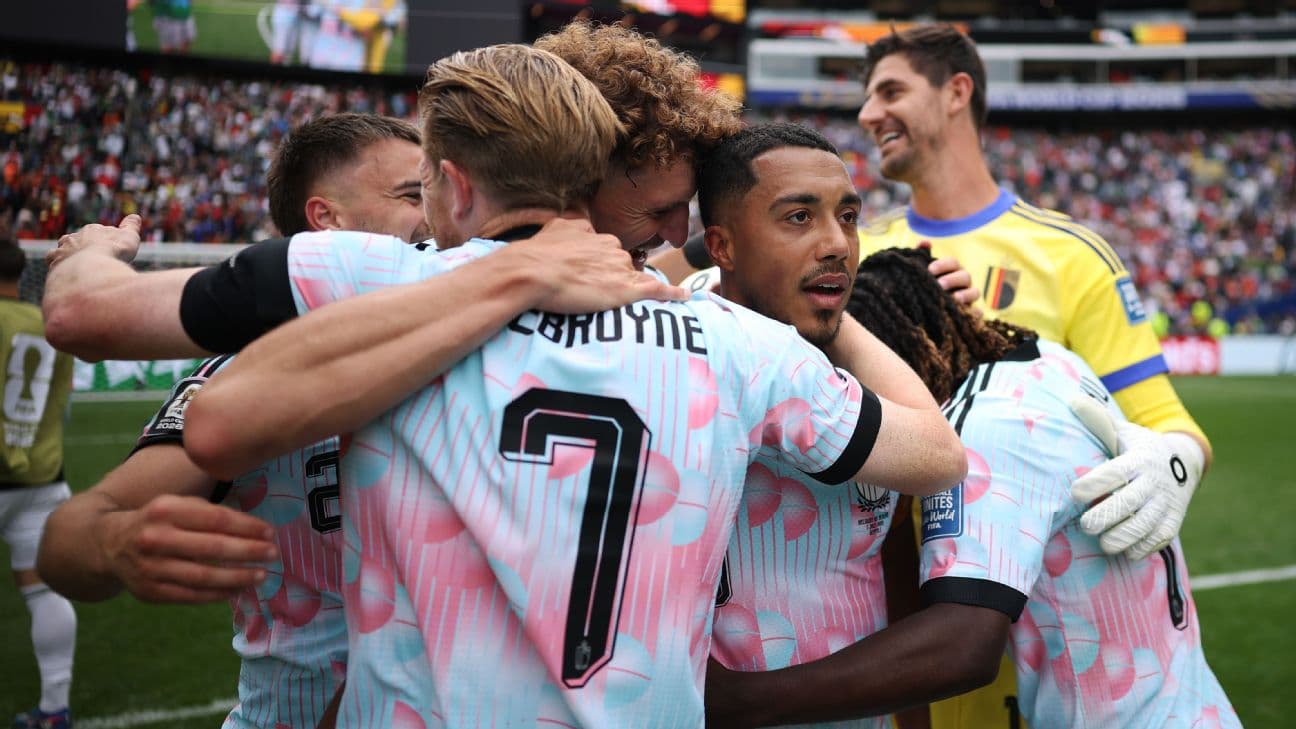 Belgium players celebrate after scoring a goal against Senegal at the World Cup.