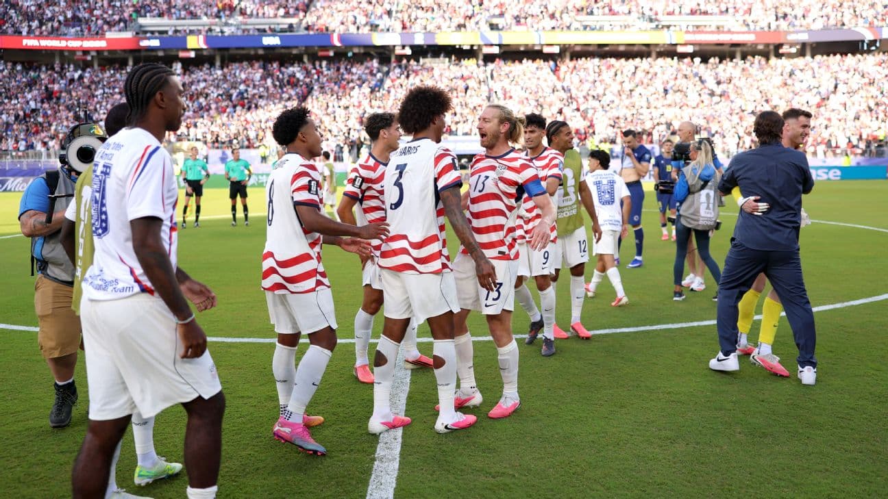 U.S. players celebrate after beating Bosnia at the World Cup to reach the round of 16.