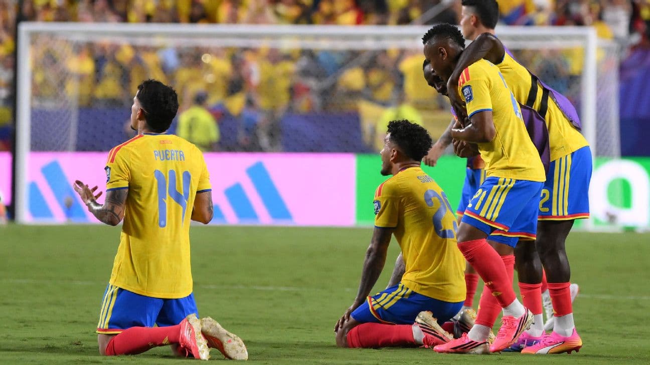 Colombia players celebrate after beating Ghana to advance to the round of 16 of the World Cup.