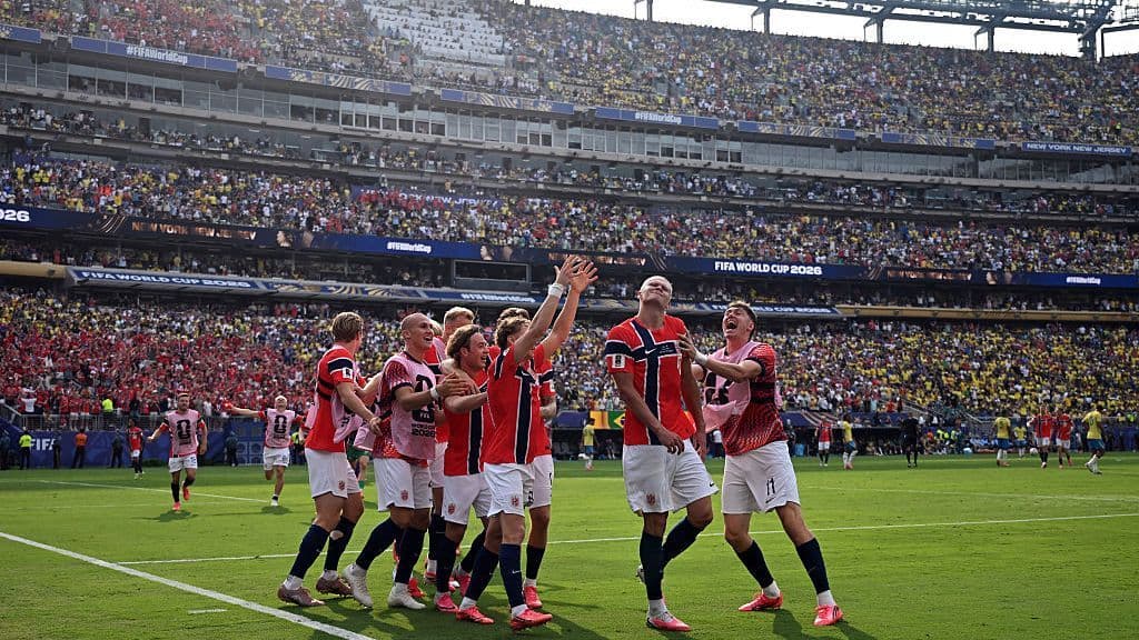 Norway players celebrate after scoring a goal against Brazil in the round of 16 at the World Cup.